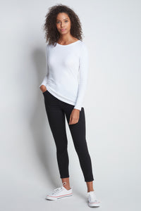 Model dressed in a quality white long sleeve crew neck t-shirt and black pants