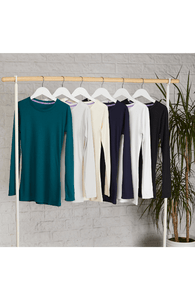 Collection of women's long sleeve crew neck t-shirts on a rack